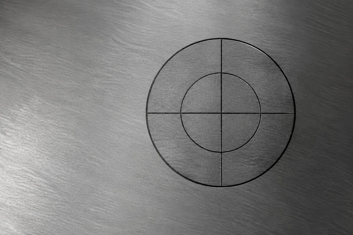 Precision target drifting off centre on a machined metal plate